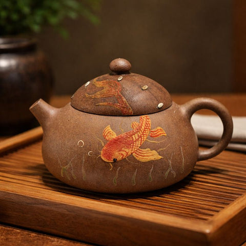 Yixing teapot with hand painted fish motief