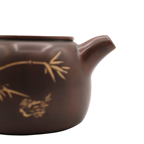 Kleine keramische theepot met decoratief motief 