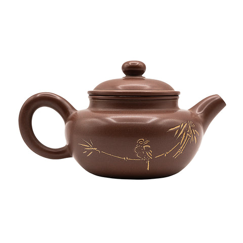 Keramische theepot met deksel en decoratief motief 