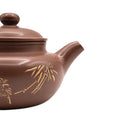 Keramische theepot met deksel en decoratief motief 