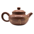 Keramische theepot met deksel en decoratief motief 