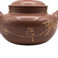 Keramische theepot met deksel en decoratief motief 