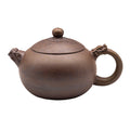 Plum Blossom Xishi woodfired Yixing clay teapot with dragon-shaped handle and spout.