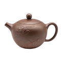 Lotus Little Xi Shi yixing clay woodfired teapot with an engraved lotus flower design.