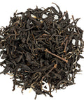 A close-up of Taiwanese Earl Grey black tea leaves with bergamot zest incorporated within.