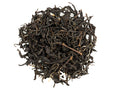 A close-up of Taiwanese Earl Grey black tea leaves with bergamot zest incorporated within.