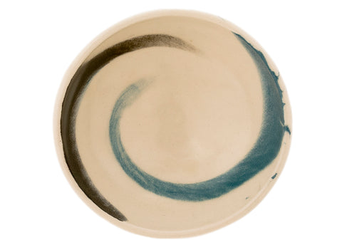 “Beige keramisch theeschaaltje met eenvoudige natuurlijke afwerking.”